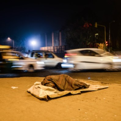 A homeless man taking shelter under the bridge of Nehru Place, South Delhi.